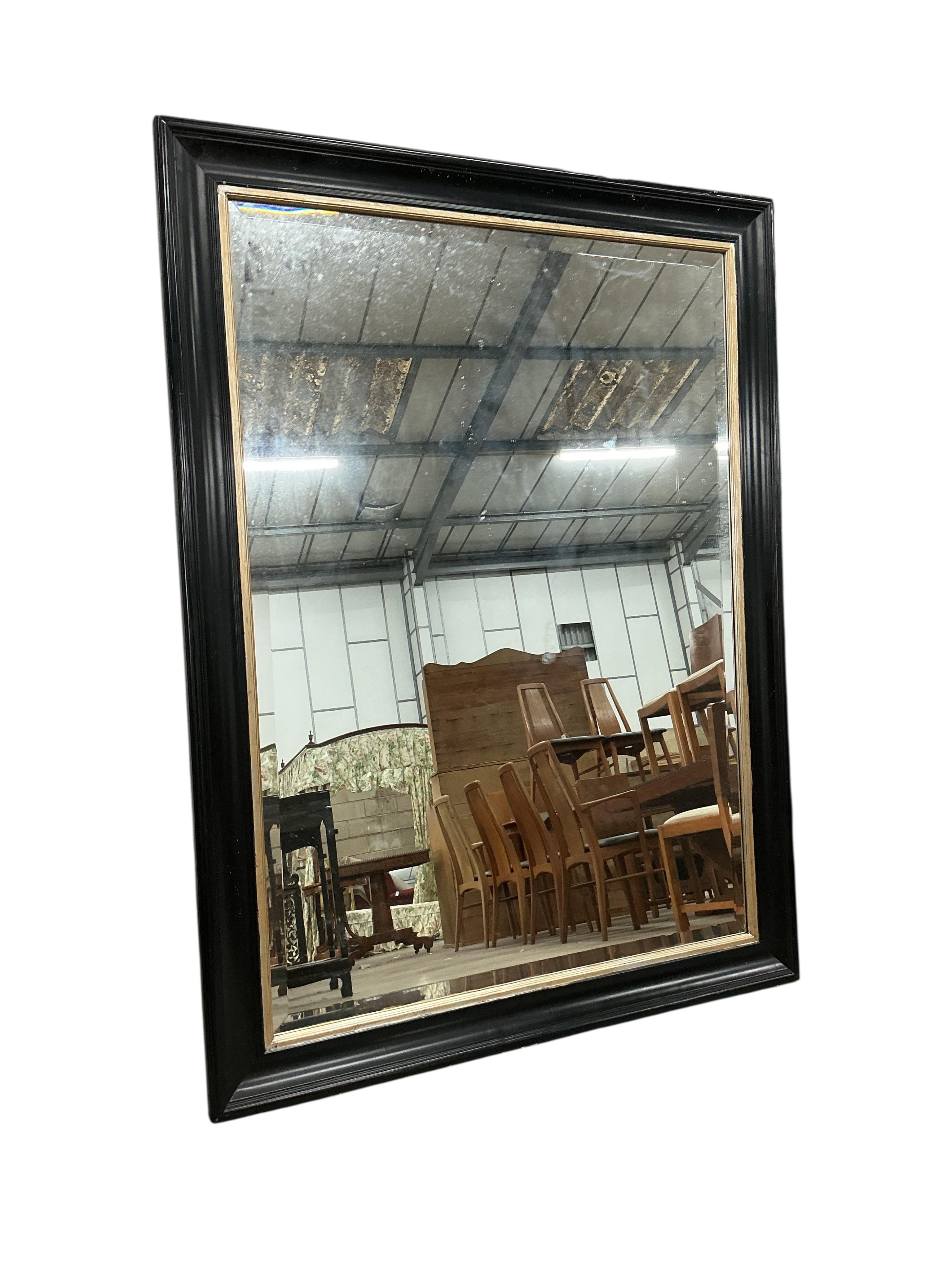 A Victorian style rectangular ebonised wall mirror, width 110cm, height 147cm